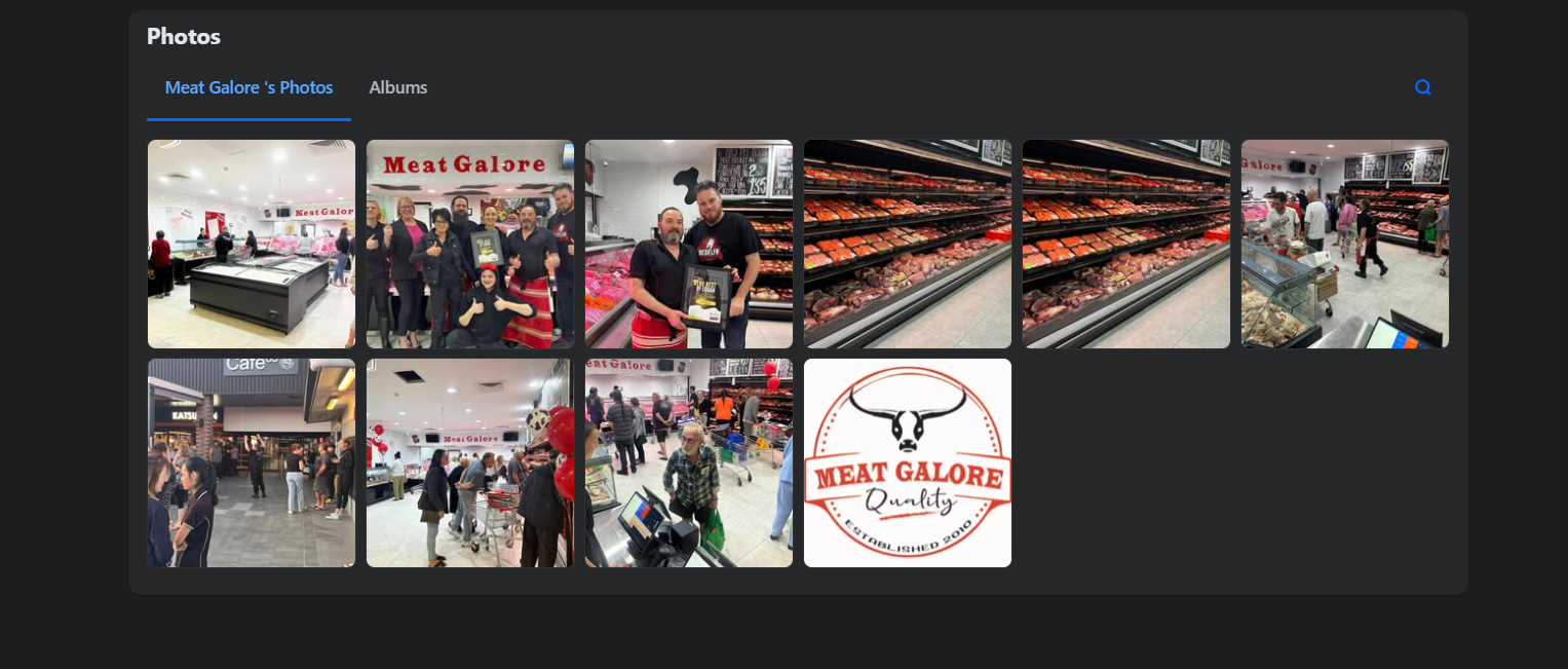 The Meat Galore team and visitors together in front of the shop sign